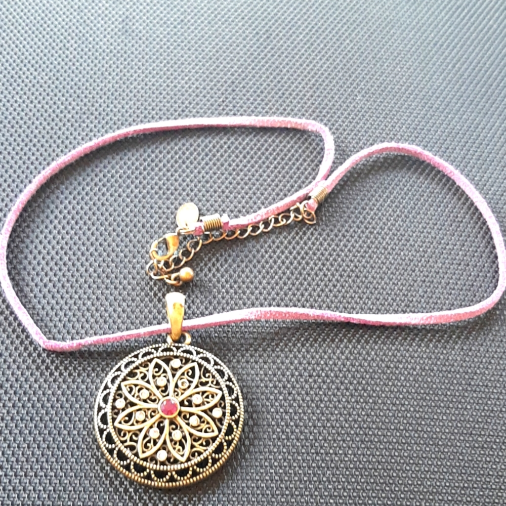 Gorgeous Lia Sophia necklace in antique brass metal with purple cut crystal